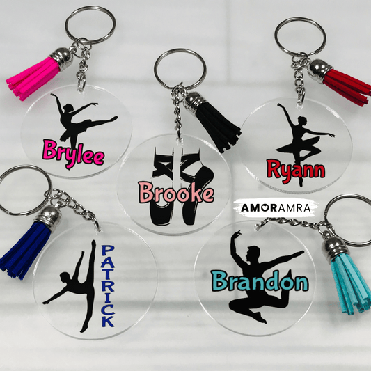Set of keychains with ballet dancer silhouettes and personalized names on clear acrylic discs. Assortment of personalized acrylic keychain designs featuring ballet dancers and ballet pointe shoes. Keychains include pink, red, black, blue, and teal tassels. Personalized Ballet Keychains, Male Ballet Dancer Gift, Ballerina Keychain, Ballet Bag Tag, Ballet Gift, Dance Bag Tags, Dance Recital Gift