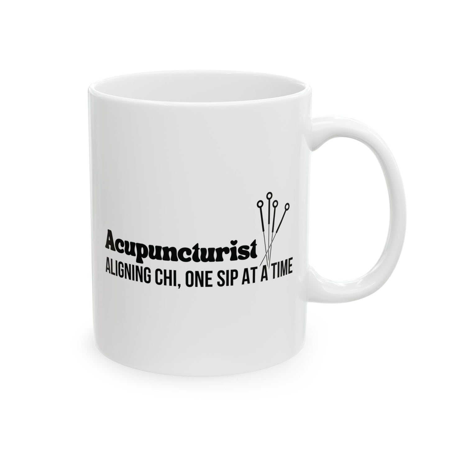 White mug with black text and acupuncture needle design on a white background