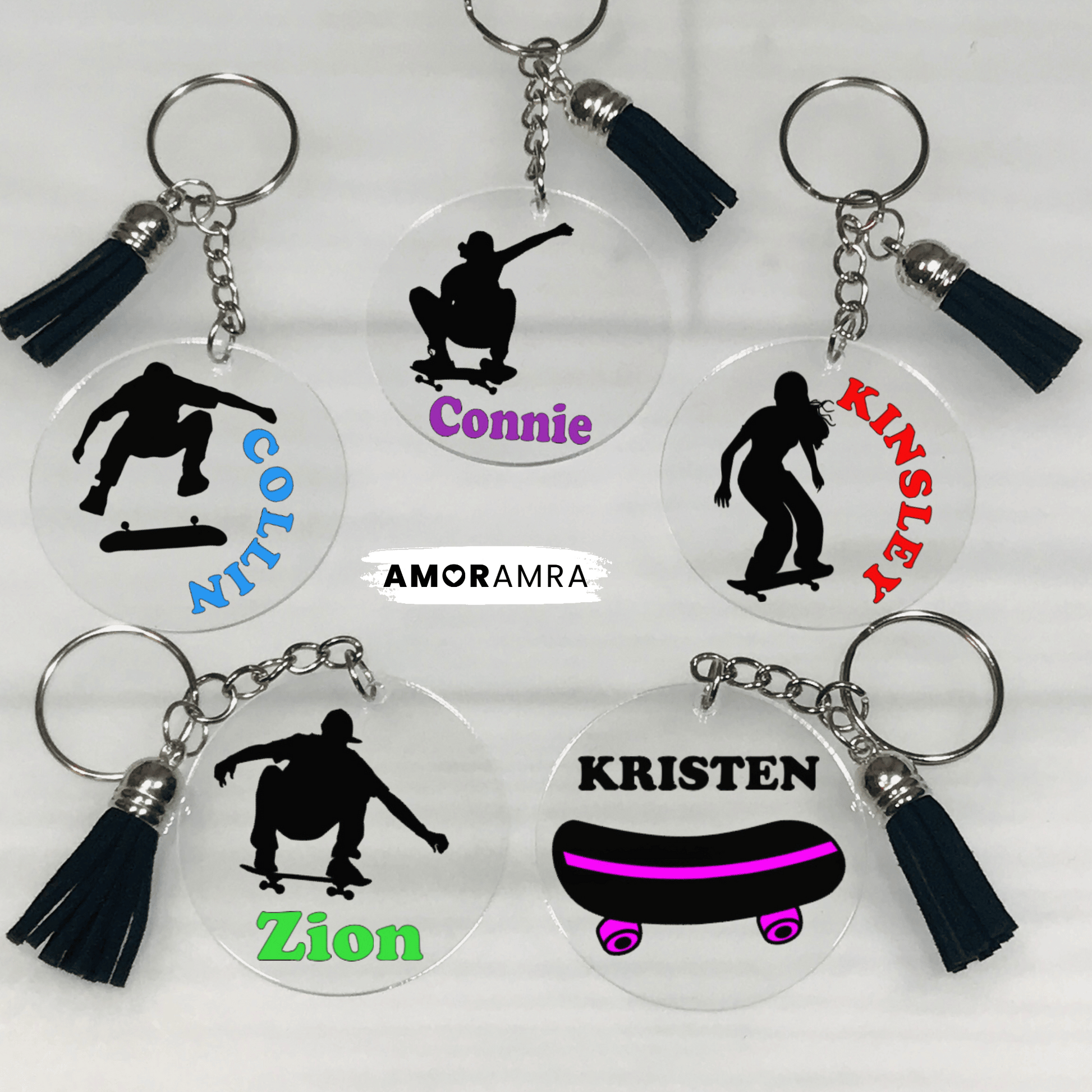 May include: Five clear acrylic keychains with black tassels. Each keychain features a silhouette of a person skateboarding with a name printed below. Personalized Skateboard Keychain, Skateboard Bag Tag, Skateboard Gift, Skateboard Lovers, Skateboarding Keychain, Skateboarder Gift, Skater