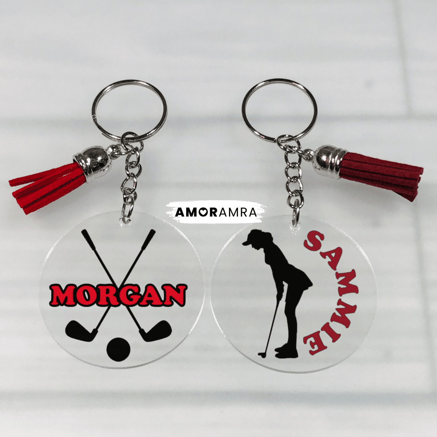Two keychains with golf-themed designs