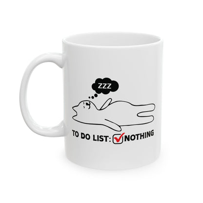 White mug with a cat illustration and text 'To Do List: Nothing' on a white background