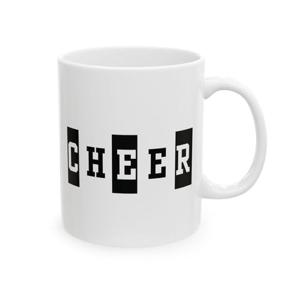 White mug with 'CHEER' printed in black letters on a white background