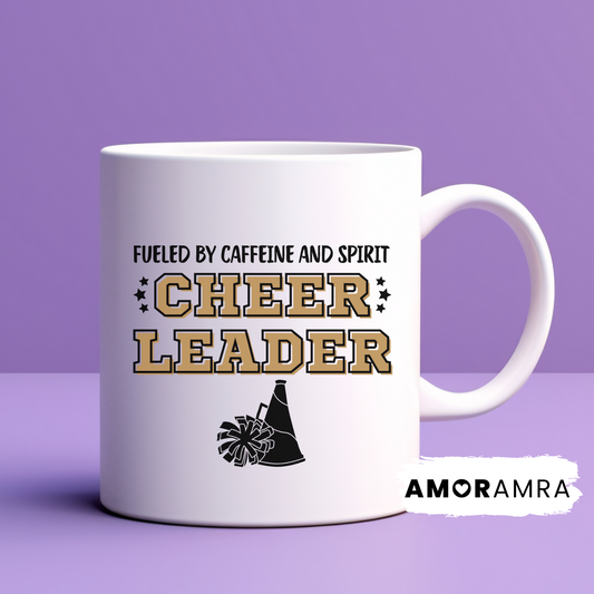 White mug with 'Fueled by caffeine and spirit, Cheerleader' text with a black megaphone and pom pom