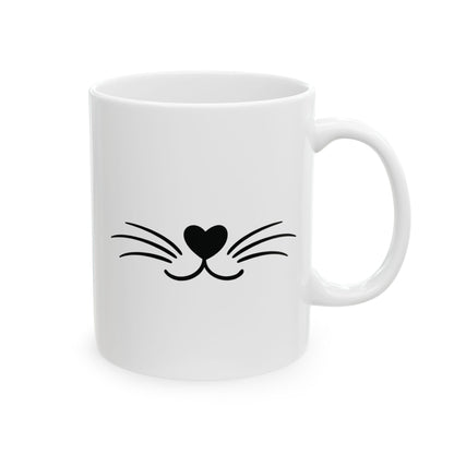 White mug with black heart and whisker cat design on a white background