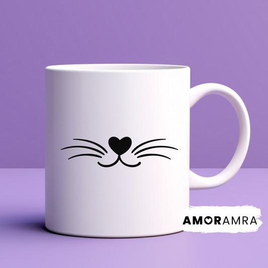 White mug with black cat whisker and heart nose design on a white background