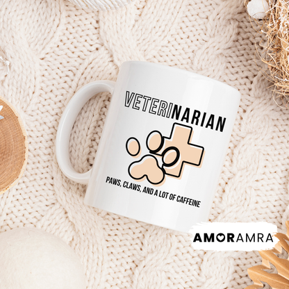 White mug with 'VETERINARIAN' text and paw print design on a textured surface, featuring the AMORAMA brand.