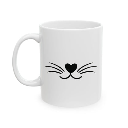 White mug with black cat whisker and heart nose design on a white background