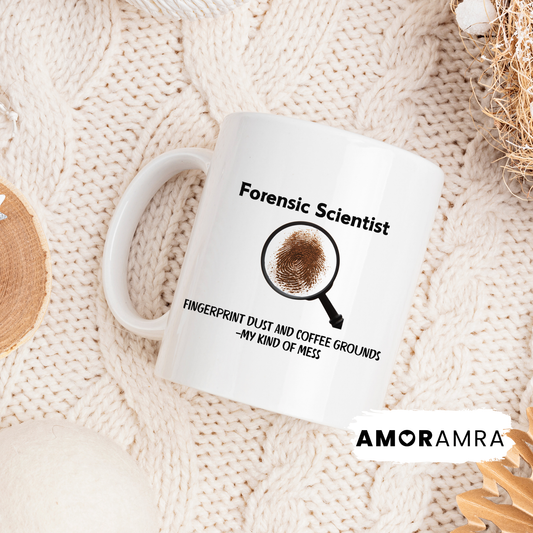 White mug with forensic scientist design and a magnifying glass with dust fingerprint and coffee grounds. fingerprint dust and coffee grounds my kind of mess text