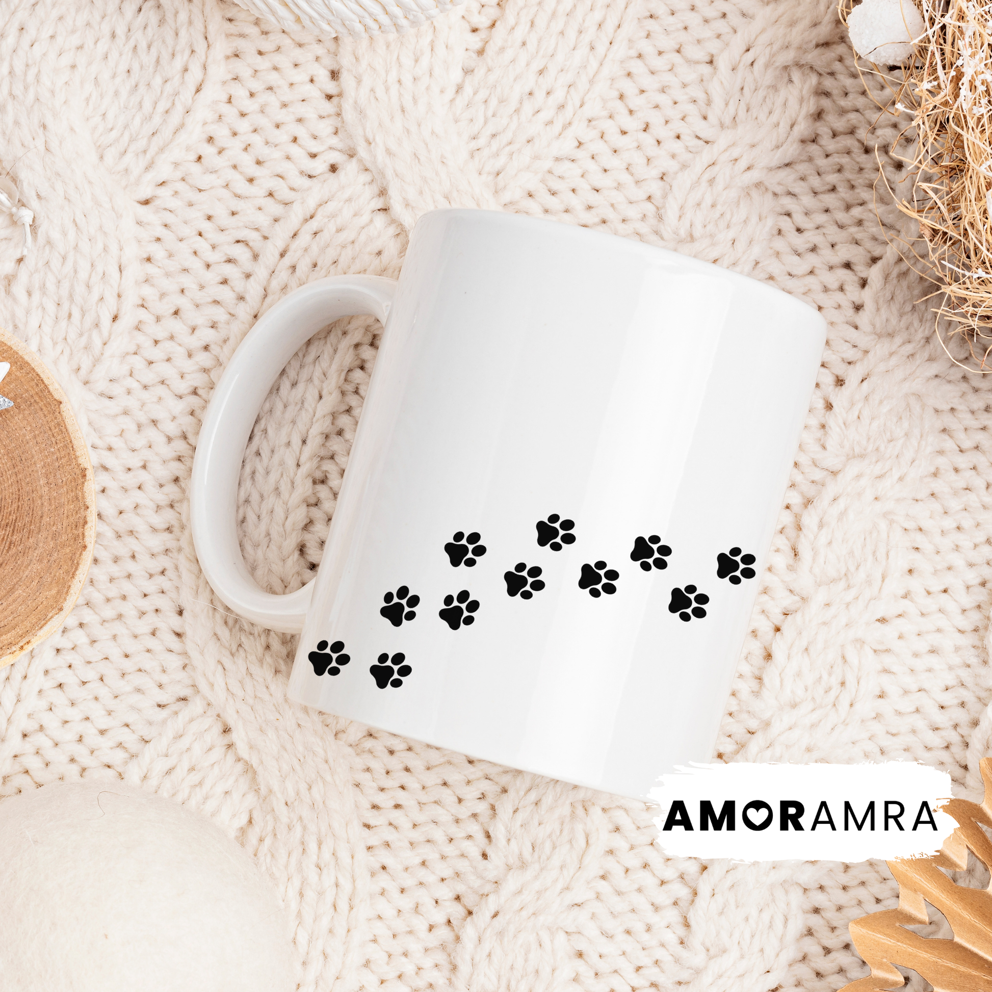 White mug with black paw prints
