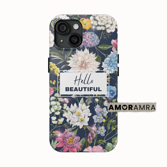 Phone case with floral design and 'Hello Beautiful' text on a white background. Delicate blooms. Soft colors. A garden you can carry. This floral iPhone case captures the timeless beauty of nature with a curated mix of flowers. 