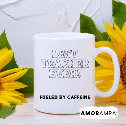 White mug with 'Best Teacher Ever! Fueled by caffeine' text.