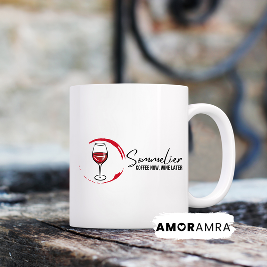 White mug with 'Sommelier Coffee Now, Wine Later'. with a glass of red wine