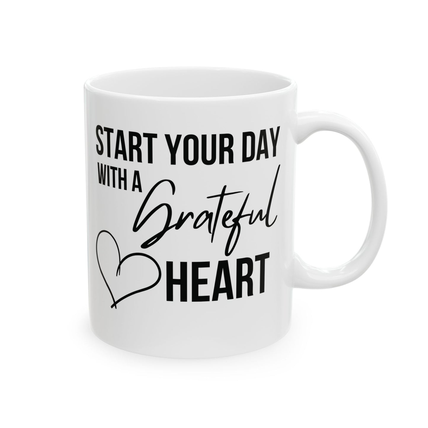 White mug with motivational quote 'Start your day with a grateful heart' on a white background