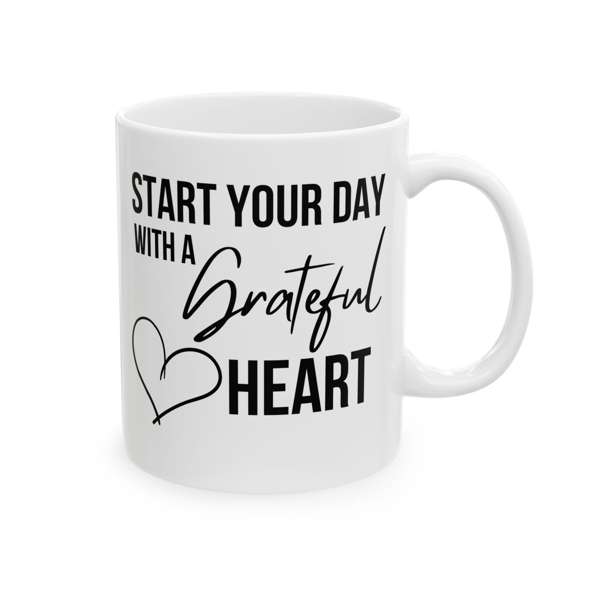 White mug with motivational quote 'Start your day with a grateful heart' on a white background