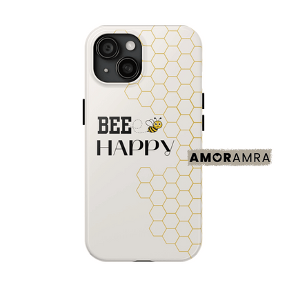 Phone case with 'Bee Happy' text and honeycomb pattern. Buzz into good vibes with this “Bee Happy” iPhone case. A daily dose of positivity wrapped in honeycombs.