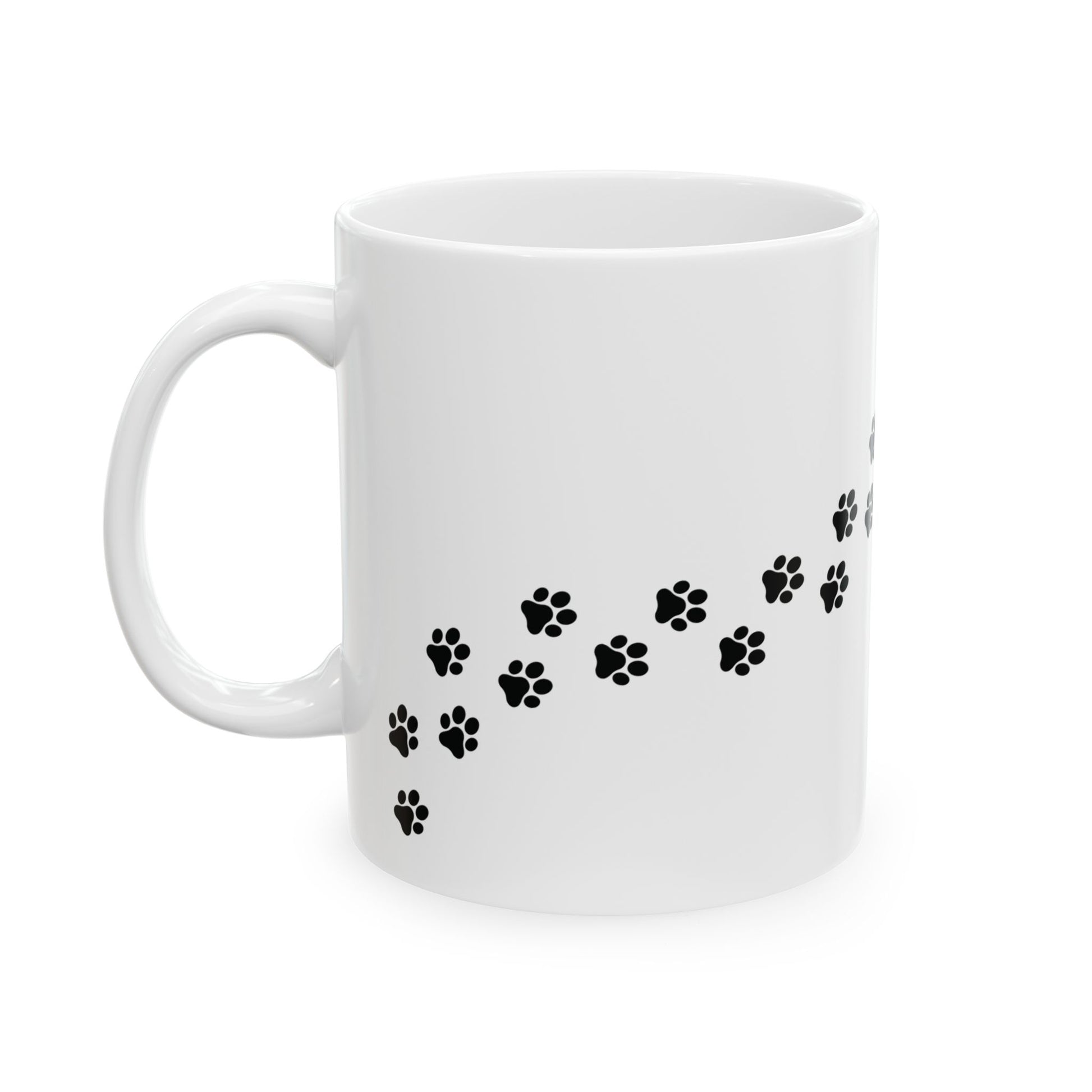 White mug with black paw print design on a white background