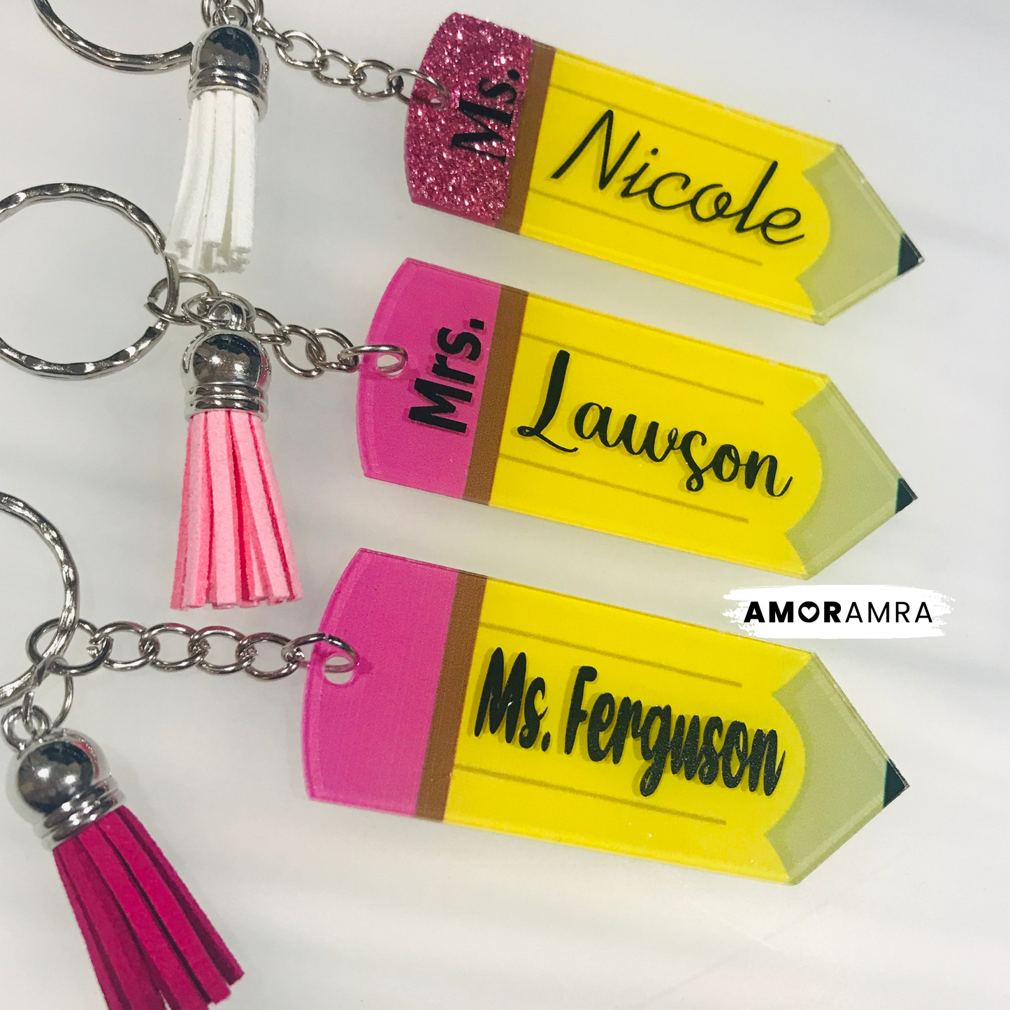 Personalized Teacher Name Pencil Keychain. yellow pencil-shaped keychains with pink and white tassels. Personalized Pencil Keychain, Teacher Appreciation Week Gift, Teacher Keychain, Acrylic Pencil Keychain, Teacher Gift, Teacher Pencil Gift
